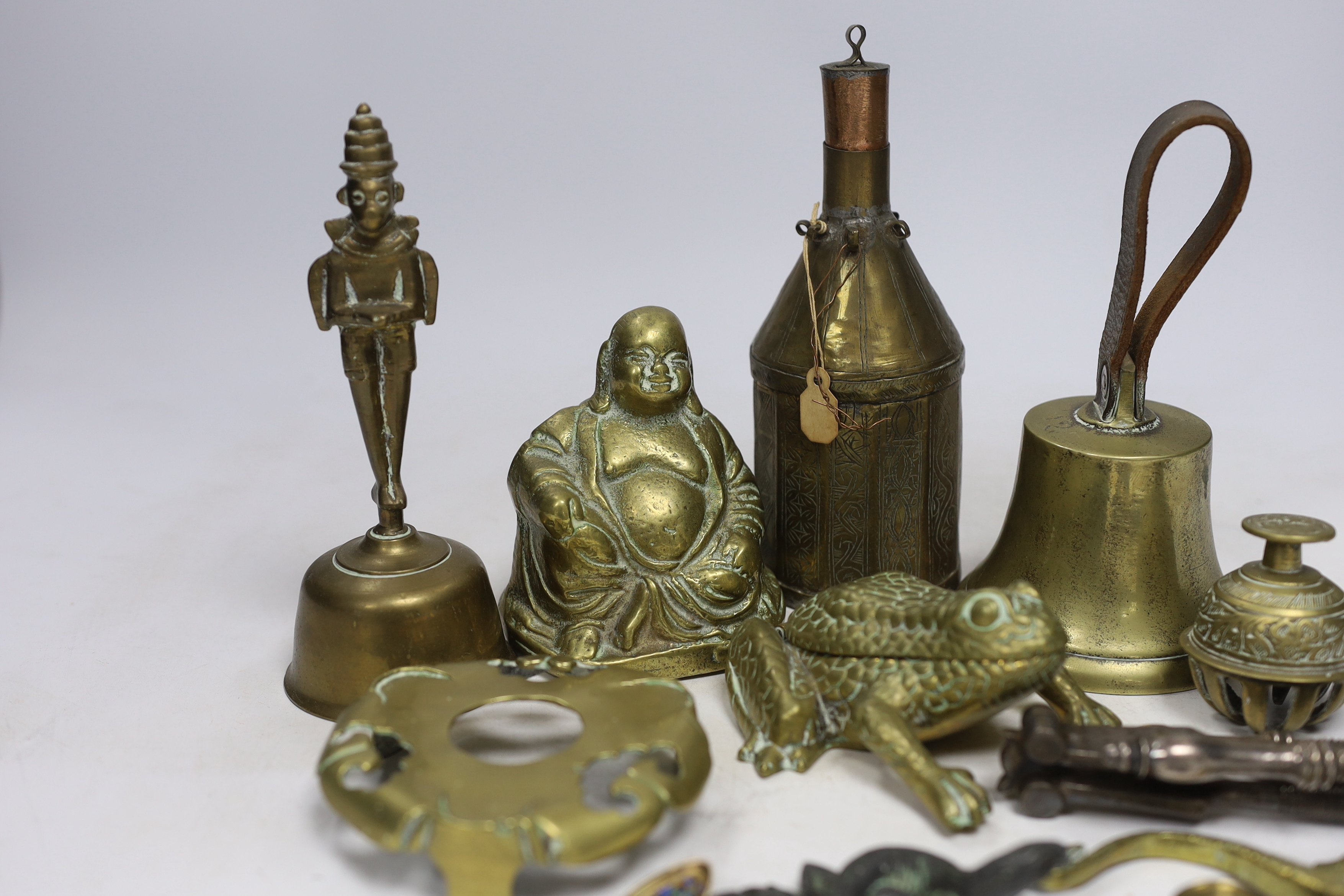 Sundry metalware including hinged brass frog with compartment, nutcrackers, a seated Buddha and a 925 gilt enamel spoon